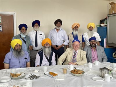 Sharing conversation over a cup of chi and samosas