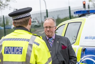 PCC Rupert Matthews with officer and car