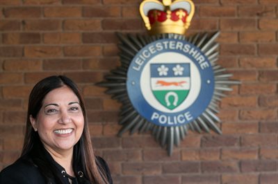 Image of Rani Mahal next to Leicestershire Police Force Crest
