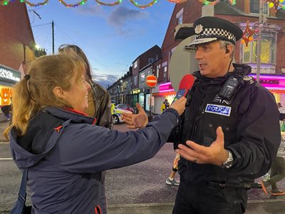 Acting Chief Constable Rob Nixon being interviewed in the street