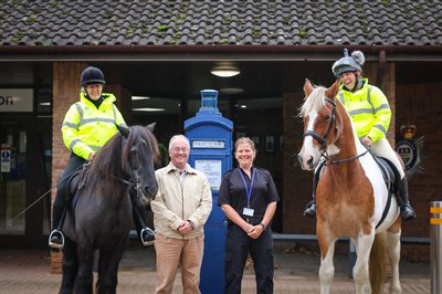 Commissioner and PC Tones with two riders on horseback